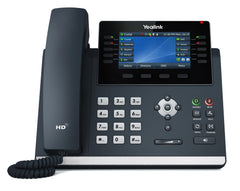 Teléfono IP ejecutivo Yealink con diseño elegante, pantalla a color de alta resolución, conectividad avanzada, y soporte para auriculares Bluetooth o USB.